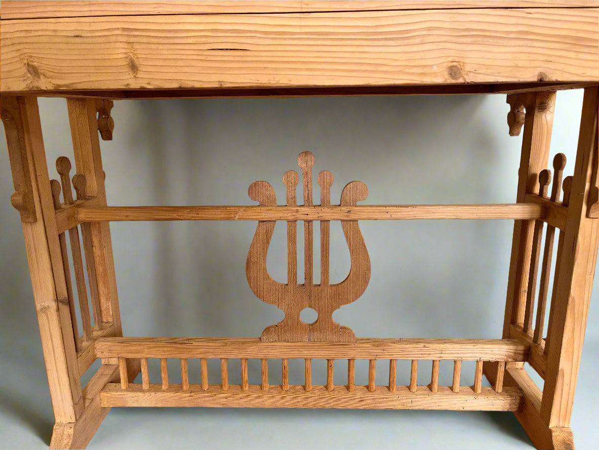 Wooden shelf with lyre design on a white wall background