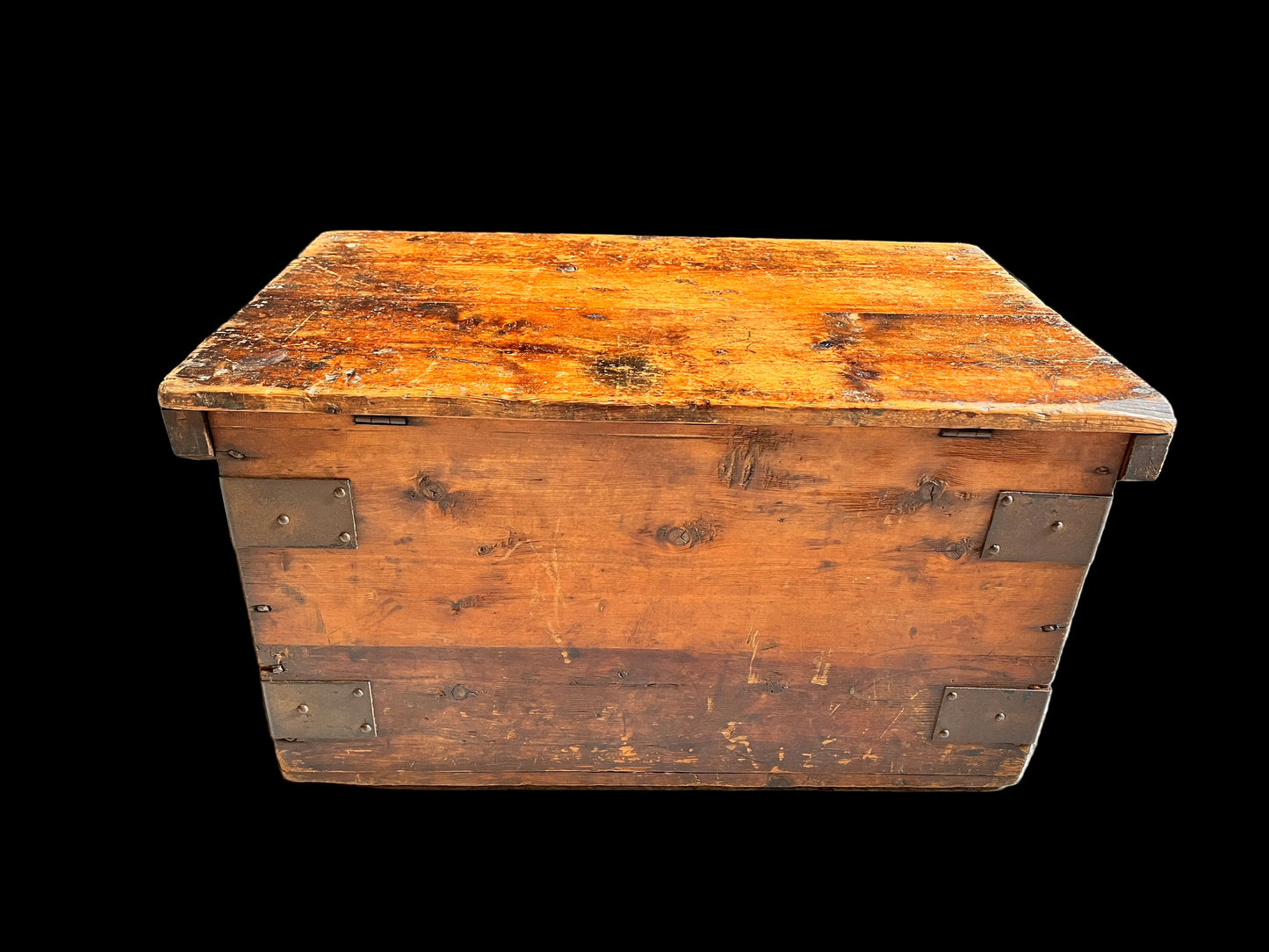 Vintage wooden trunk with metal straps on a gray background