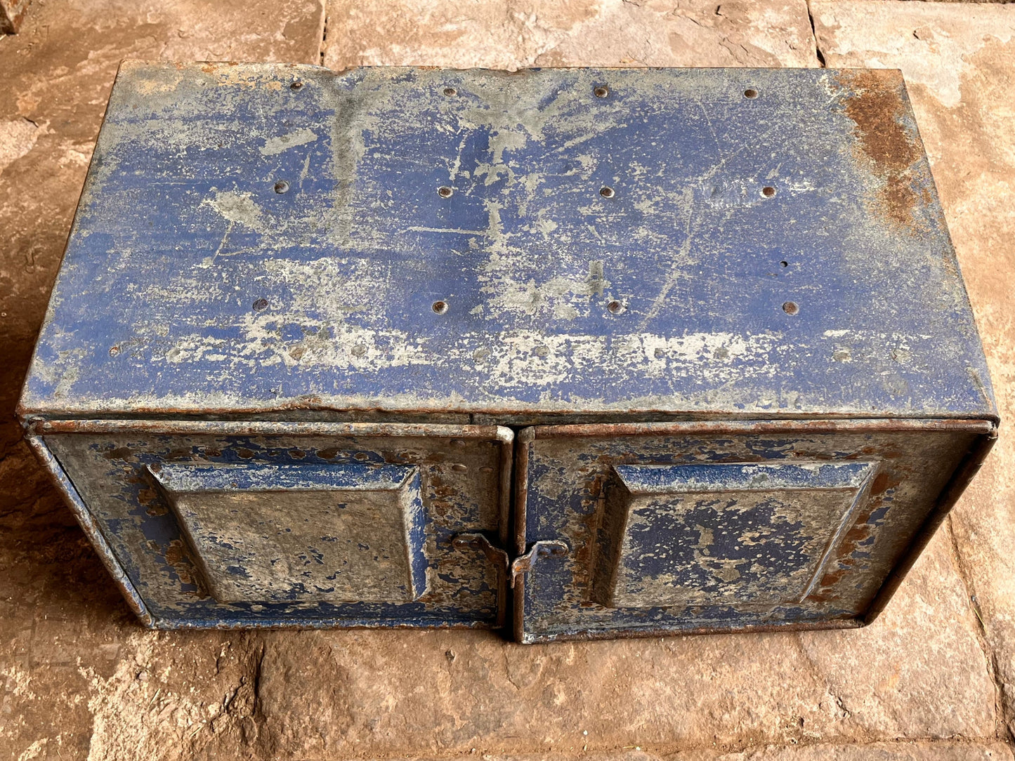 Industrial style metal cabinet with aged blue paint