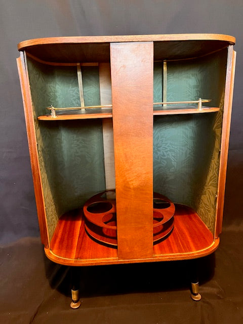 Mid Century Bow Fronted 'Sureline' Cocktail Drinks Cabinet In Walnut By George Serlin With Tambour Sliding Doors On Splayed Atomic Legs