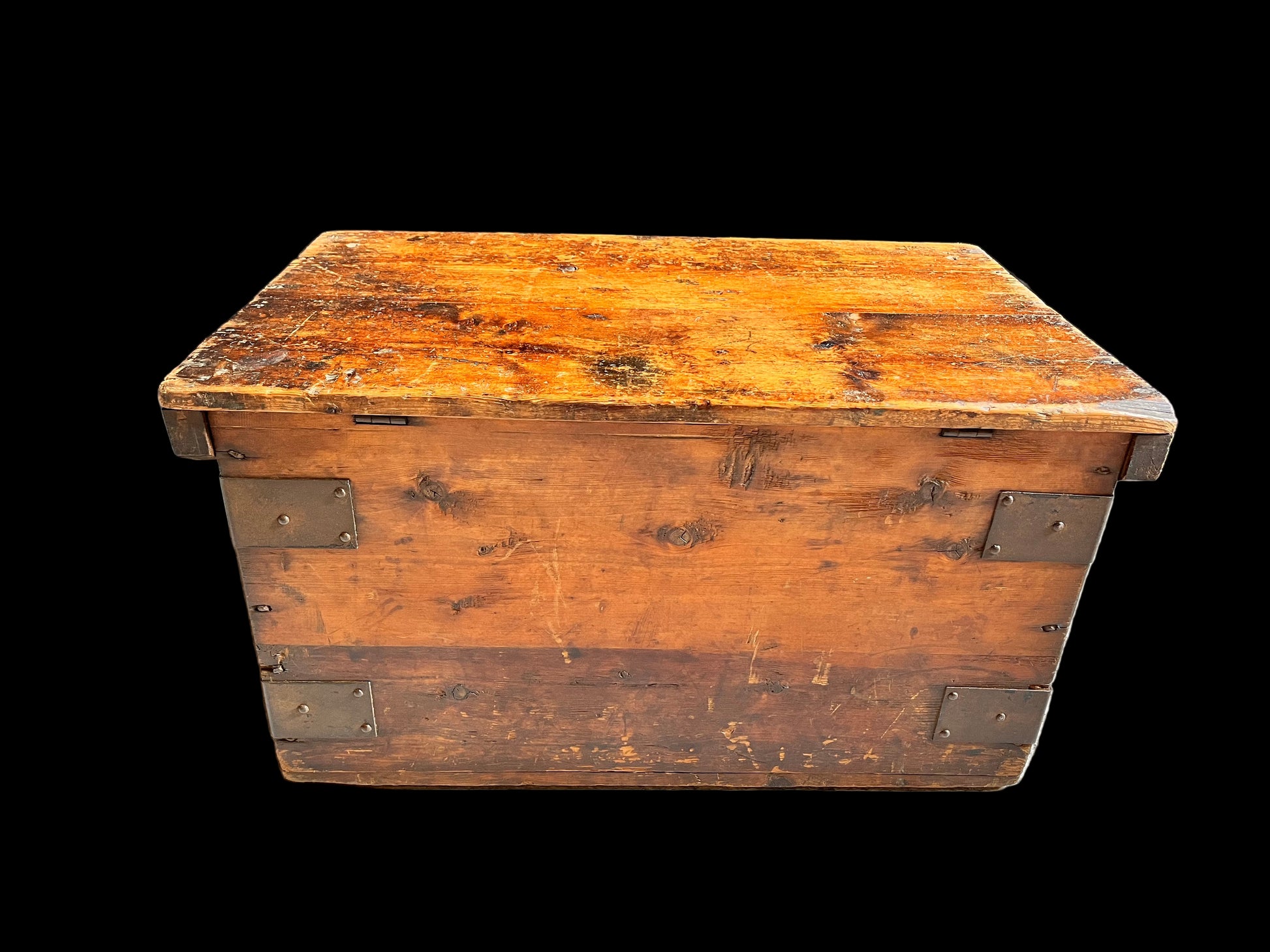 Vintage wooden trunk with metal straps on a gray background