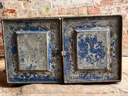 Industrial style metal cabinet with aged blue paint
